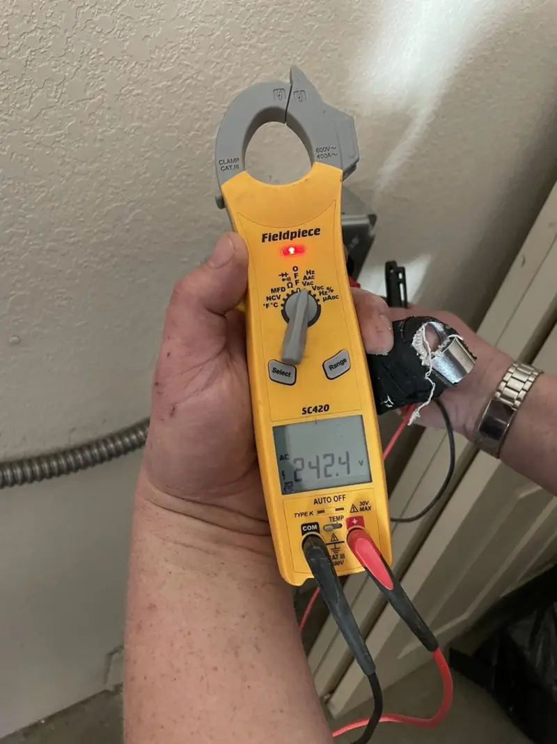 Voltage testing with clamp meter during Electrical Installation Services in Fishersville